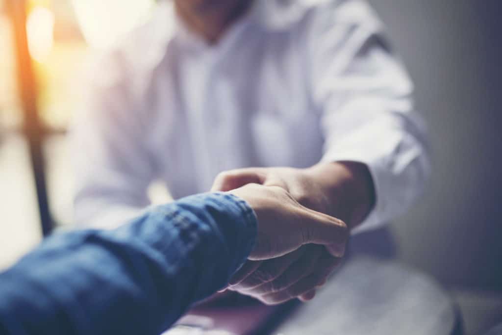 Two people shaking hands